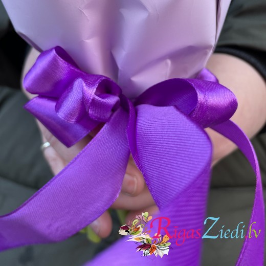 Purple tulips in a decorative package