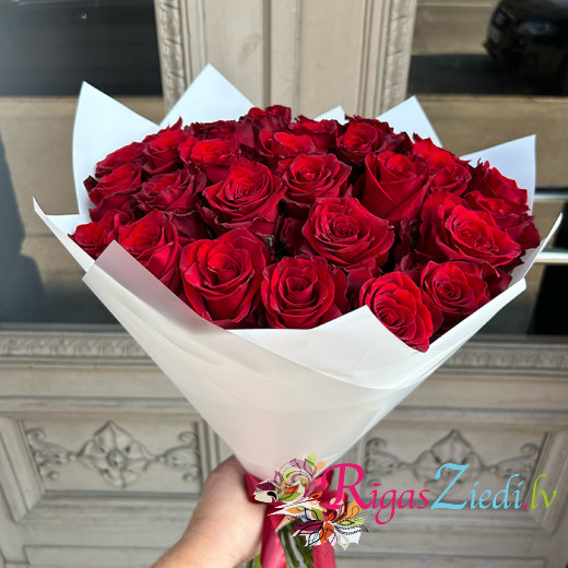 Red roses in white packaging