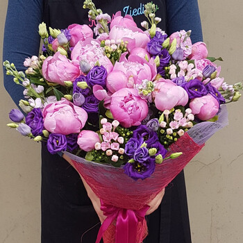 A bouquet of pink peonies and purple eustoma