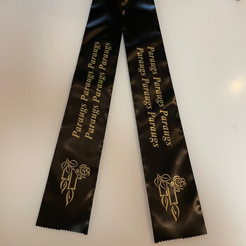 Black funeral ribbon with inscription