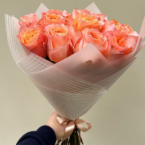 Coral Reef rose bouquet side view with mesh paper and satin ribbon