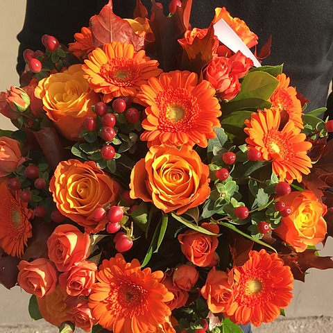 Autumn bouquet Colorful Autumn - roses, gerberas and hypericum close-up